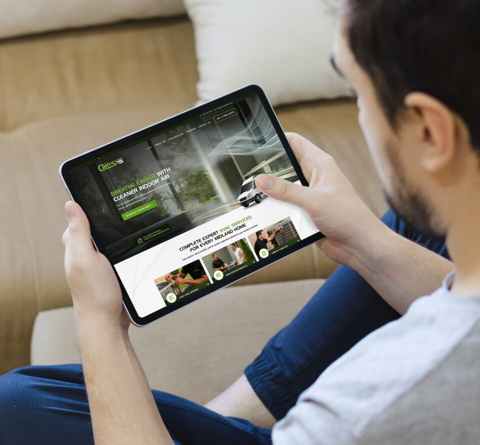man searching website on tablet